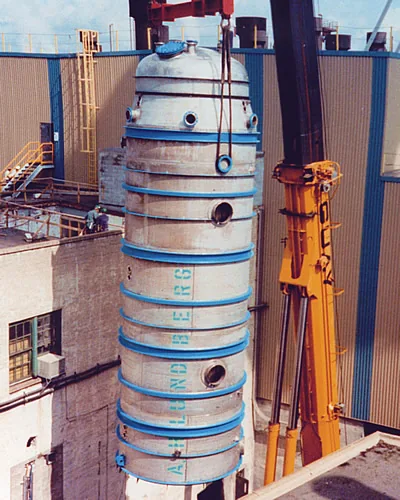 Vessel lettered A.H. Lundberg being installed at a mill